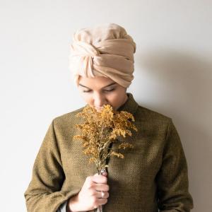 Photo of Nafeesah Meerun holding a small bouquet